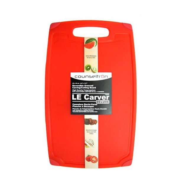 Counseltron Le Carver Reversible Grooved Carving Cutting Board in mandarin orange, rectangular with rounded corners and a handle cutout. Made from high-density polypropylene with deep juice grooves and santoprene grippers on all corners for slip resistance. Dishwasher safe and ideal for professional and home kitchen use, also suitable for chopping vegetables and carving meats.