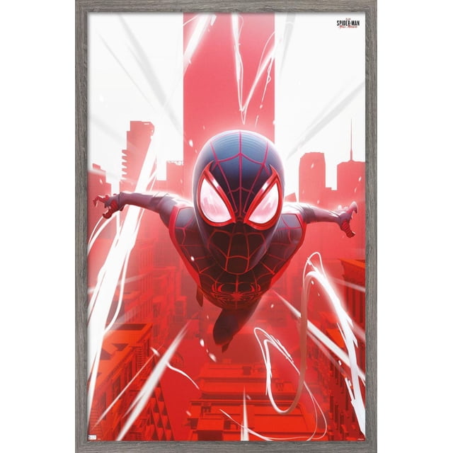 Marvel's Spider-Man: Miles Morales - Falling Wall Poster, 22.375" x 34" depicts a front-facing view of Spider-Man in a black and red suit diving through a red cityscape with white light streaks, printed on glossy paper and framed in grey wood, suitable for bedroom or office wall decor.