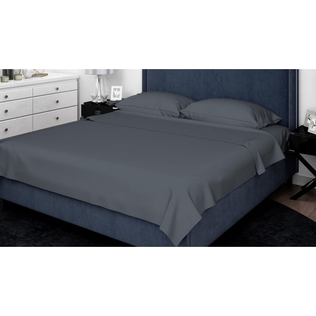 Johnson Home 200 TC Bed Sheet Set - 100% Cotton Sheets in dark grey, including fitted and flat sheets with matching pillowcases on a king bed with navy blue upholstered headboard and silver nailhead trim, in a modern bedroom setting with white dresser and black nightstand, featuring breathable cotton fabric suitable for all seasons.