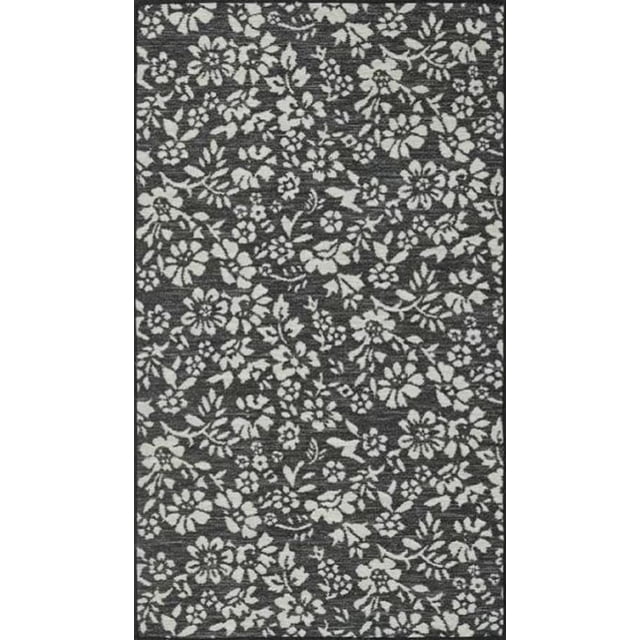 Home Décor Inc. 27" x 45" reversible grey rug with a light grey floral pattern on a dark grey textured background, designed as an accent area rug for bedrooms, living rooms, or entryways, also suitable for layering with other rugs.