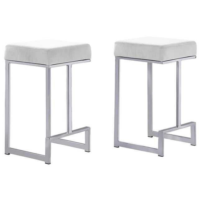 Dorrington Velvet Backless Counter Height Stool in White/Silver (Set of 2) with white velvet upholstery and a silver stainless steel base. These modern counter stools feature a rectangular cushion and open-frame legs, ideal for kitchen or bar seating. Dimensions are 14.5 inches long, 14 inches deep, and 25 inches high.
