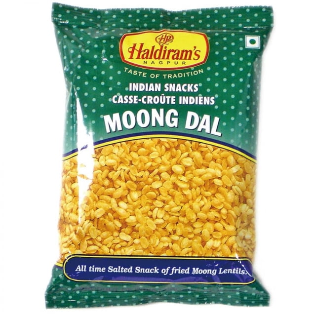Haldiram Moong Dal in a green polka dot bag showing yellow fried moong lentils, an Indian salty snack or namkeen ideal for casual snacking and as an accompaniment with drinks during gatherings.