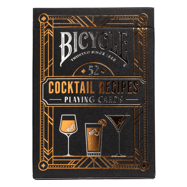 Bicycle Cocktail Playing Cards deck box with black background and copper and silver foil accents, featuring 52 cocktail recipes like Manhattan and Zombie, with detailed cocktail glass illustrations, ideal for poker and game room use.