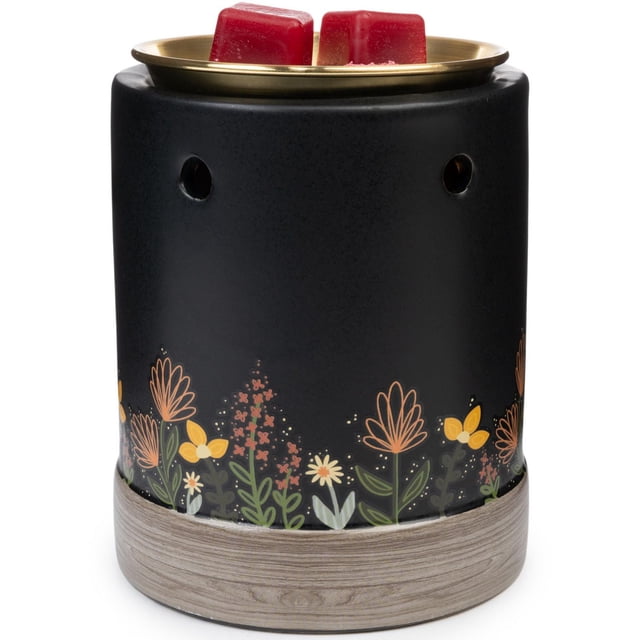 ScentSationals, Full Size Warmer, Betty with a matte black cylindrical body featuring orange, yellow, and white floral patterns above a wood-textured base, topped with a brass-colored dish holding two red wax cubes for safe indoor fragrance melting.