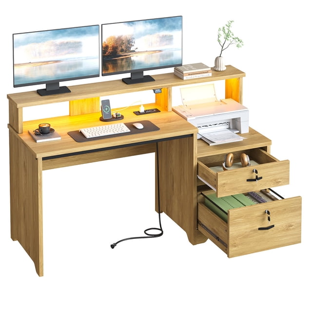 Bestier 55 inch Computer Desk with Power Outlets & LED Lights in natural oak finish. Features include a raised monitor stand with dual monitors, a built-in charging station with USB-A and USB-C ports, a printer shelf, and two open drawers including a lockable file drawer. The desk also has customizable RGB LED lighting and a spacious 55-inch work surface suitable for home office or gaming setups.