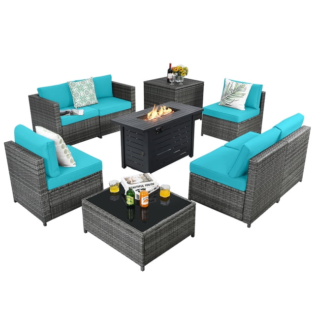 Patiojoy 9 PCS Rattan Dining Set with turquoise cushions, including six modular sofas, a propane gas fire pit table with 60,000 BTU heat output, a storage box, and a coffee table. Made of weather-resistant PE rattan and a sturdy steel frame, this set is ideal for indoor and outdoor use. The fire pit table features a tempered glass top and can also function as a coffee table. Cushions have removable covers for easy cleaning. The set is arranged in a circular layout with the fire pit at the center, offering a stylish and functional outdoor seating solution.