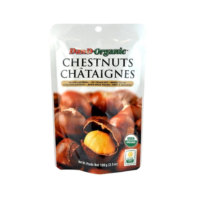 Dan-D-Pak Organic Chestnuts in a white resealable pouch featuring a close-up of brown chestnuts with one cracked open showing the yellow nut inside, labeled USDA Organic and California Certified Organic Farmers, net weight 100 grams (3.5 oz), no cholesterol, no trans fat, ready to eat, often used as a healthy nut topping for snacks and desserts.