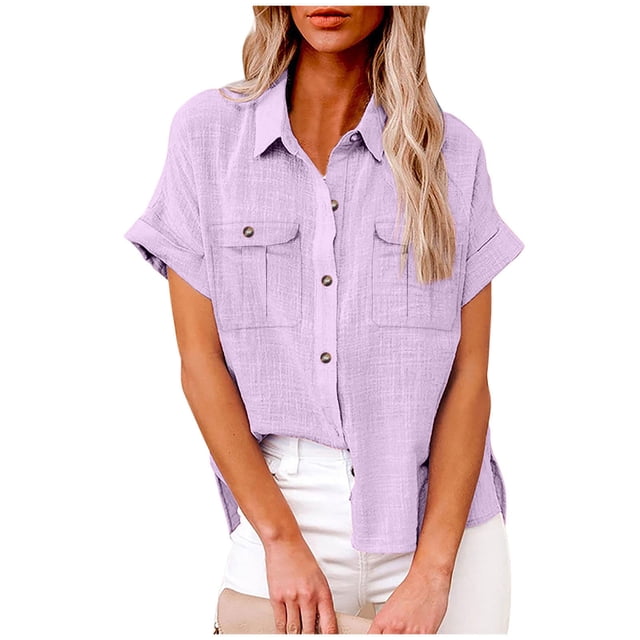 fheaev Button Up Shirts For Women Roll Up Short Sleeve Button Down Cotton Linen T-Shirts With Pocket V-Neck Work Tunics Blouse Collared Tops. The shirt is shown in a solid lavender colour with a lightweight, breathable cotton-linen fabric. It features a V-neckline, short rolled-up sleeves, button-down front, and two chest pockets. Styled with white pants, it is suitable for casual, work, or vacation wear.