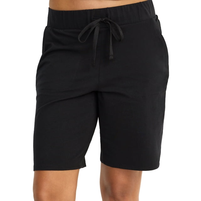 Jockey Women's Organic Cotton Stretch Bermuda Short in black, featuring a regular fit with a 9-inch inseam. Made from 95% organically-grown cotton with a hint of stretch, the breathable fabric ensures comfort and coolness. The relaxed fit and soft material provide ease of movement, ideal for lounging or sleeping.