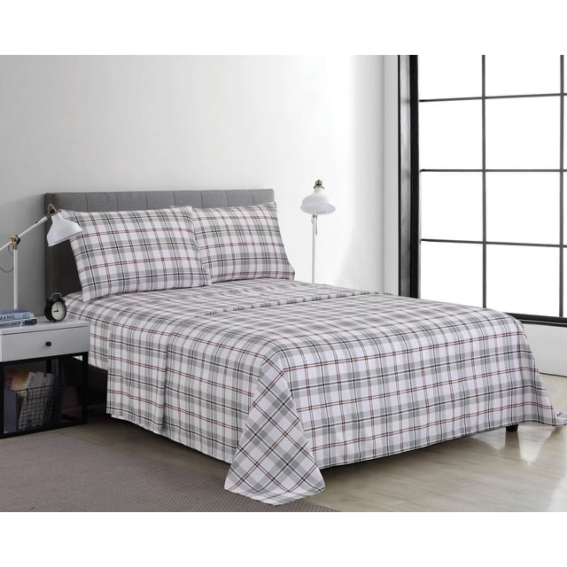 4 Piece Microfibre Sheet Set Grey Plaid on a bed with a grey upholstered headboard, featuring a grey and white plaid pattern with thin red lines. The set includes wrinkle-resistant, double brushed microfiber fabric sheets with a deep pocket fitted sheet for mattresses up to 14 inches. The bed is in a minimalist room with light wood flooring, a white nightstand with a lamp and clock, and a large window with black grid framing. Suitable for easy care with machine washable fabric.