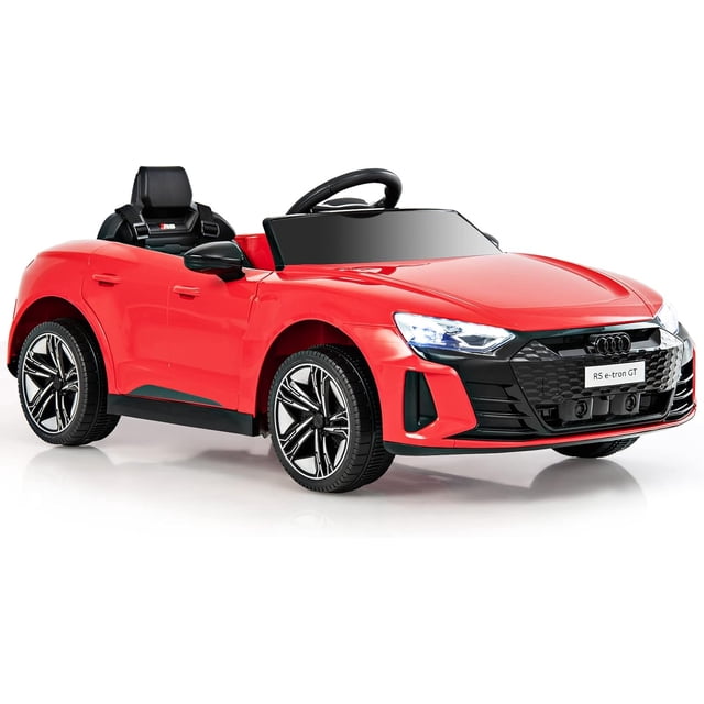 OLAKIDS Kids Ride on Car, Licensed 12V Electric Vehicle in a vibrant red finish with realistic design elements including LED headlights, a rotatable steering wheel, and a foot pedal. This battery-powered toddler toy features a spring suspension system, a wide seat with a 2-point seat belt, and a multimedia panel with USB, MP3, and TF card ports for music options. The car can be operated by children using the steering wheel and pedal or by parents with the included 2.4GHz remote control. Suitable for children aged 37-96 months with a maximum weight capacity of 66 lbs.