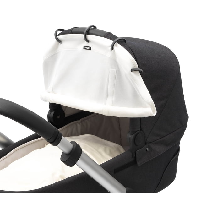 Universal Sun & Weather Cover for Strollers & Car Seats in cream, shown attached to a black stroller. The cover features breathable mesh panels and adjustable height for protection against light, wind, sun, noise, and light rain. Made of Oekotex cotton, it offers UPF50+ sun protection and is machine washable.
