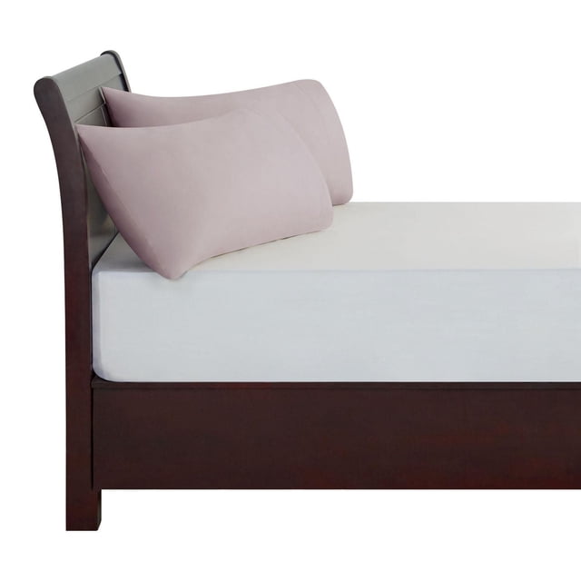 Hometrends 100% Cotton Pillowcases in muted pink displayed on a dark wood bed frame with a light grey fitted sheet, showing two standard-size pillowcases made with 400-thread count, wrinkle-resistant cotton fabric, ideal for enhancing bedroom bedding sets with breathable comfort.