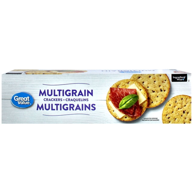 Great Value Multigrain Crackers box with a white wood-textured background, showing round multigrain wheat crackers with visible grains and seeds. One cracker is topped with cheese, salami, and a basil leaf. The packaging features the Great Value logo and Ingredient Wise symbol, highlighting low saturated fat and trans fat free content. These snack crackers are ideal for party platters and everyday snacking.