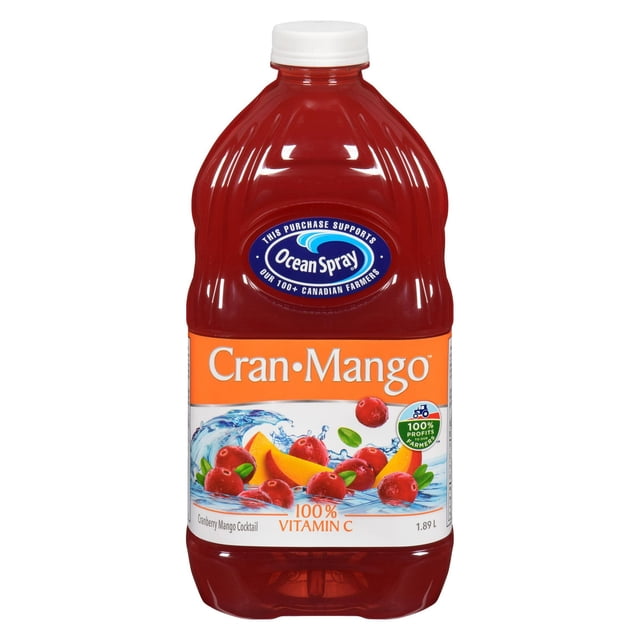 Ocean Spray Cran•Mango™ Cranberry Mango Cocktail in a 1.89 L plastic bottle with white screw cap, featuring a label with cranberries and mango slices splashing in water, providing 100% vitamin C and supporting Canadian farmers, often enjoyed with sparkling water or spirits.