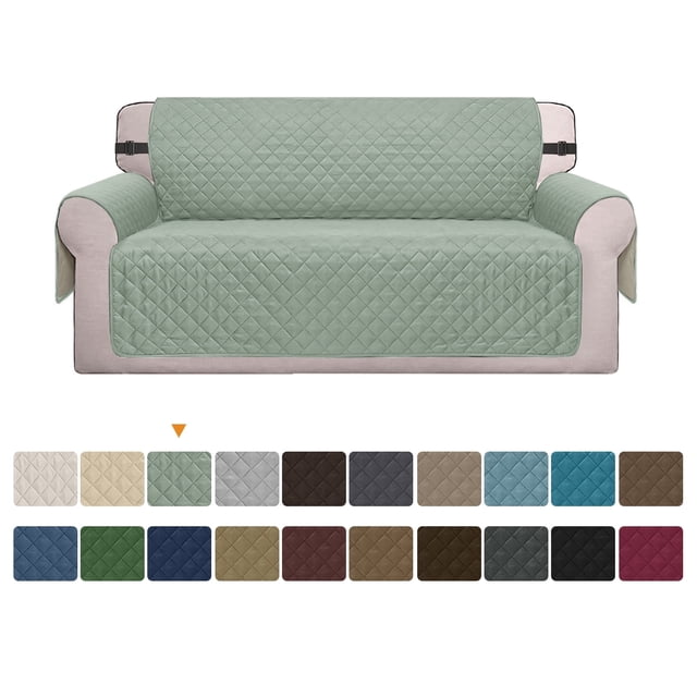 Reversible sofa cover with a quilted design in a light green color, displayed on a beige couch. Features elastic straps for a secure fit, water-resistant material, and machine washable fabric. Includes a selection of 14 color options shown below the main image, ideal as a furniture protector for pets and children.