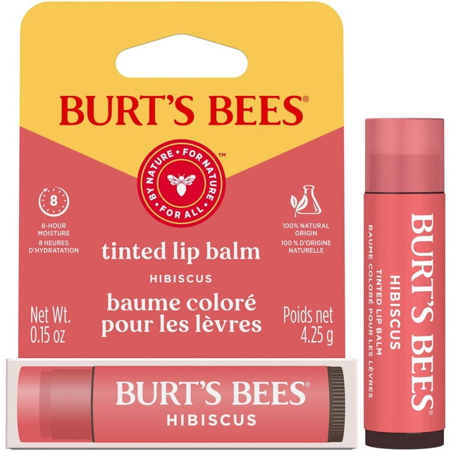 Burt's Bees 100% Natural Origin Moisturizing Tinted Lip Balm, Hibiscus with Shea Butter in a pinkish-red twist-up tube with white text, shown with its pink and yellow packaging card highlighting 8-hour moisture and natural ingredients, net weight 0.15 oz (4.25 g).