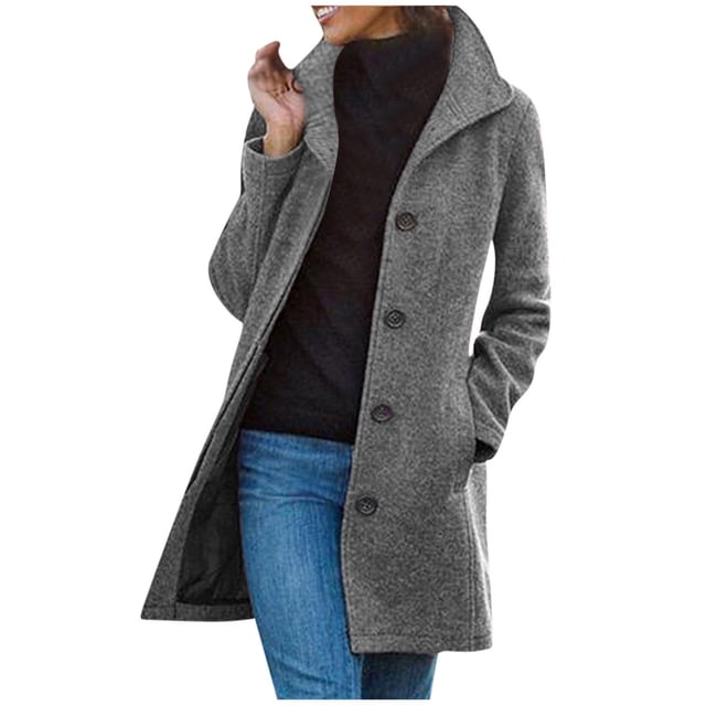Pompotops Women's Solid Color Pocket Woollen Coat Recreational Long Sleeve Tops in grey. This long-length coat features a loose fit, button closure, and side pockets. Made of polyester, it is suitable for casual, daily, or work settings. Shown paired with jeans and a black top.