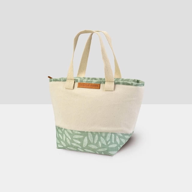 Out of the Woods Mini Shopper Lunch Beauty Leaf insulated lunch bag with natural canvas upper and green leaf-patterned base, dual polycotton handles, zipper closure, and extra-thick lining for cooling, sustainable and reusable for school, office, or trips.