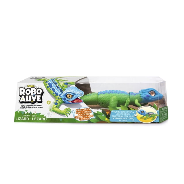 Zuru - Robo Alive Robo Alive Robotic Lizard in clear packaging, showing a green and blue segmented robotic lizard with realistic yellow eyes, soft rubber head and tail, and a tilt sensor that stops movement to simulate hunting, ideal as a STEM technology toy for children aged 3 and up.