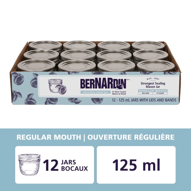 Bernardin Decorative Mason Jars, Regular Mouth, 125 mL, 12 Count, showing twelve clear glass jars with silver metal lids and bands in a blue box with quilted crystal design, BPA-free and freezer-safe, ideal for canning, storing herbs, and gifting homemade preserves.