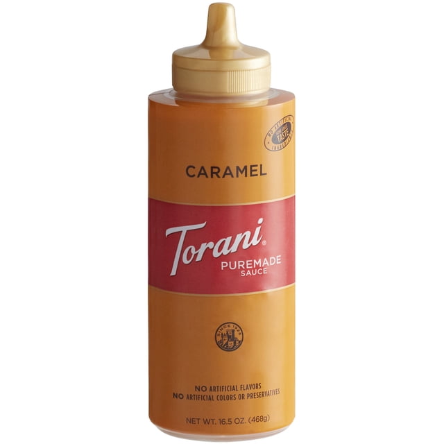 Torani 12 fl. oz. (16.5 oz.) Puremade Caramel Flavoring Sauce in a caramel-colored plastic squeeze bottle with a red label and pointed dispensing cap. Designed for easy use, it adds rich caramel flavor to coffees, desserts, and specialty drinks. Free from artificial flavors and preservatives.