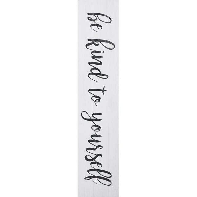 hometrends Distressed Wood Sign Be KIND to Yourself is a vertical white wood wall décor sign with black distressed script lettering, measuring 7 inches by 37 inches, ready to hang and suitable for adding inspirational style to home interiors.