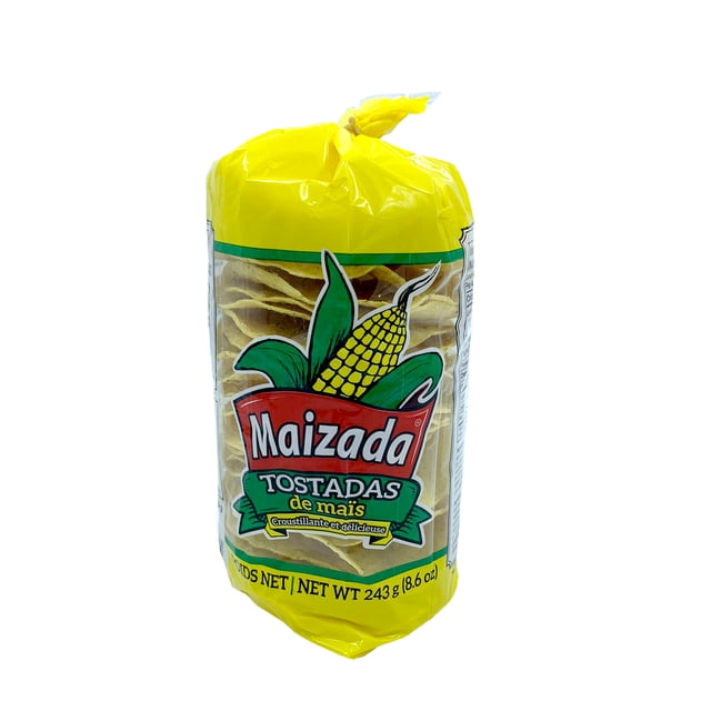 MAIZADA REGULAR TOSTADAS in a yellow plastic bag with a clear window showing round corn tostadas inside, featuring a corn cob graphic and brand name, net weight 243 g (8.6 oz), made from nixtamalized corn masa and suitable for shelf storage, often used as a base for snacks or appetizers.