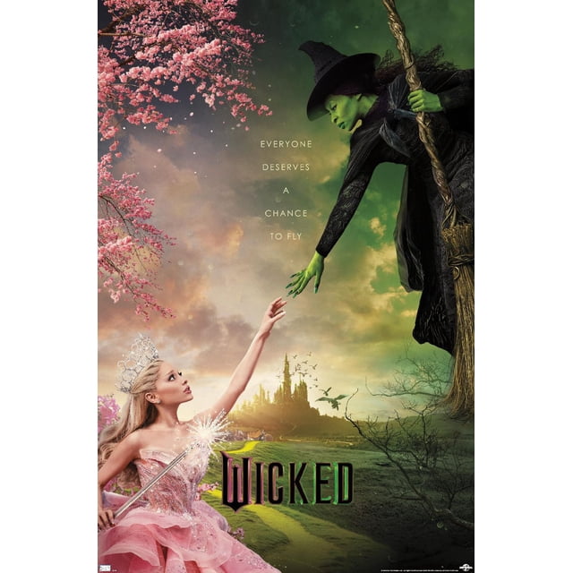 Wicked - One Sheet Wall Poster, 22.375" x 34" depicting a green-skinned witch in a black textured dress and pointed hat holding a broomstick, reaching out to a princess in a pink sparkling gown and silver tiara holding a glowing wand, set against a backdrop of a castle on a hill, a green and yellow path, pink cherry blossom branches, and a cloudy sky with flying birds, with the text 'Everyone deserves a chance to fly' and the stylized title 'Wicked'.