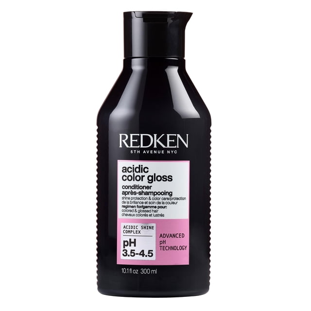Redken Acidic Color Gloss Conditioner for color-treated hair with color protection, designed to prolong hair color and add shine. The 300 mL black bottle features a pink and white label highlighting advanced pH technology and benefits for hair care and shine enhancement.