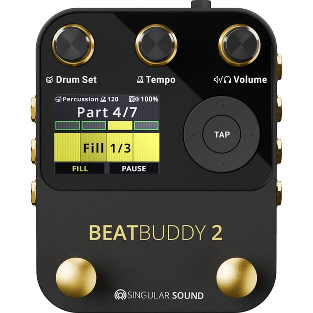 Singular Sound BeatBuddy 2 Drum Machine featuring a compact black and gold design with a large screen displaying 'Part 4/7' and 'Fill 1/3' for visual feedback. Includes controls for drum set, tempo, and volume, along with dual footswitches for hands-free operation. Offers studio-grade 24-bit/44.1 kHz audio, true stereo I/O, and 5-pin MIDI In/Out. Compatible with BeatBuddy Manager Online and supports up to 32 GB SD card storage.