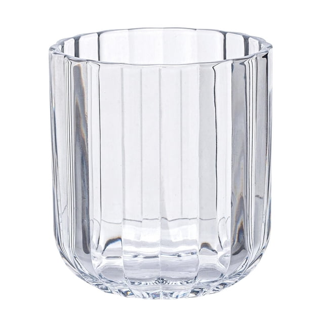 Better Homes & Gardens 12 Ounce Clear Fluted Tumbler Glass 12PK showing a close-up front view of a clear soda-lime glass with vertical fluted ridges, holding 12 ounces, designed for cold beverages and suitable as stylish drinkware in kitchens.