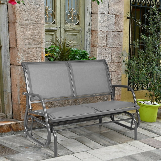 Gymax 48'' Outdoor Patio Swing Glider Bench Chair Loveseat Rocker Lounge Backyard in grey, featuring a sturdy steel frame and breathable fabric. Designed for two adults with a weight capacity of 400 lbs, it measures 48.5''L x 28''W x 34''H. The bench includes a curved backrest and armrests for added comfort, and a smooth gliding mechanism for relaxation. Ideal for patios, gardens, and backyards.