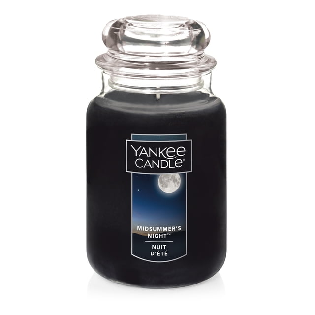 Yankee Candle Scented Candle MidSummer's Night 22 oz Original Large Jar with black paraffin wax in a clear glass jar and rounded lid, featuring a label with a full moon night sky, offering over 110 hours burn time and a masculine musk, patchouli, sage, and mahogany fragrance, suitable for enhancing home décor ambiance.