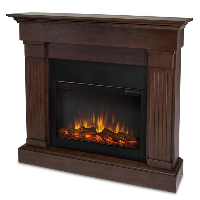 Crawford 48" Slim Electric Fireplace in chestnut oak finish with a slim 9.5-inch mounting depth, classic mantel featuring fluted columns, and vivid flame LED technology displaying orange and yellow flames over glowing logs in a black firebox, ideal for supplemental heating in rooms up to 1000 sq ft.