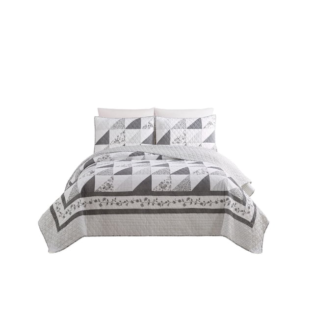 Better Homes & Gardens Quilt in full/queen size with matching shams, featuring a grey and white stylized floral and geometric patchwork pattern. The quilt has a 100% cotton face, polyester back, measures 90 by 92 inches, and is machine washable for easy care.