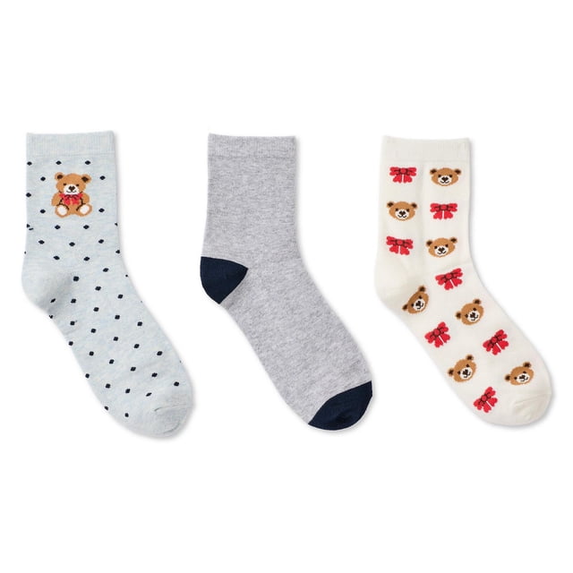 George Women's Mid-Crew Socks 3-Pack with three pairs of cotton-rich mid-crew socks laid flat. One pair is light blue with navy dots and a teddy bear with a red bow near the cuff. Another pair is solid grey with navy heel and toe. The third pair is cream with repeated teddy bear faces and red bows. These socks feature ribbed cuffs for secure fit and breathable fabric, suitable for daily casual wear and light indoor activities.