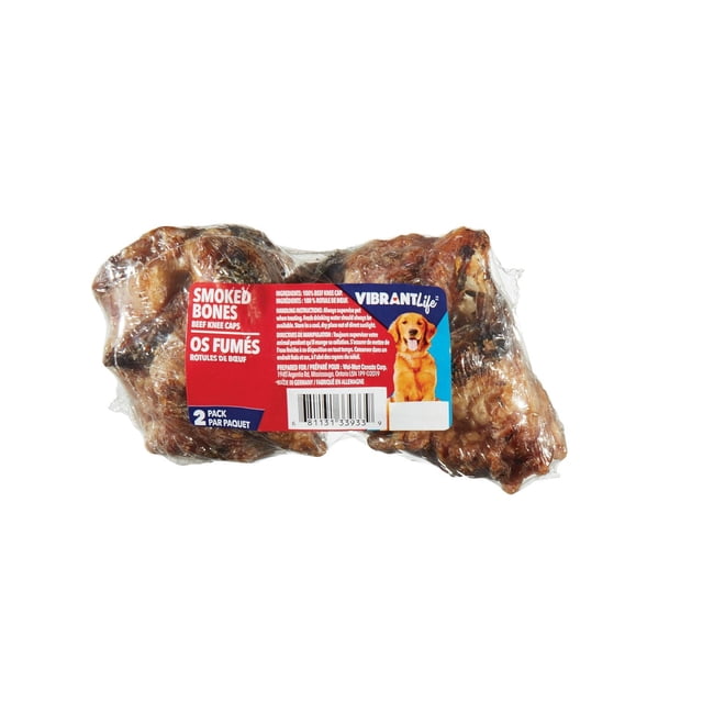 Vibrant Life Knee Cap 2 pack of natural smoked beef knee caps dog treats in clear plastic packaging with red and blue label featuring a golden retriever and bilingual English-French text, suitable for rewarding dogs.