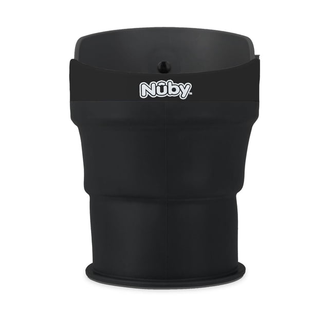 Nûby™ Collapsible Cup Holder in black with flexible, foldable silicone body and front-facing Nûby logo, designed as a stroller accessory to hold bottles, cups, and snack containers securely.
