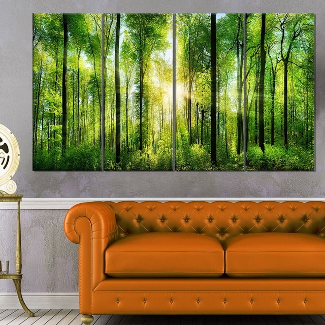 Design Art Forest with Rays of Sun Panorama Landscape Canvas Print, a five-panel gallery wrapped cotton canvas featuring sun rays shining through tall green trees and dense foliage, ready to hang in living or office spaces above furniture.
