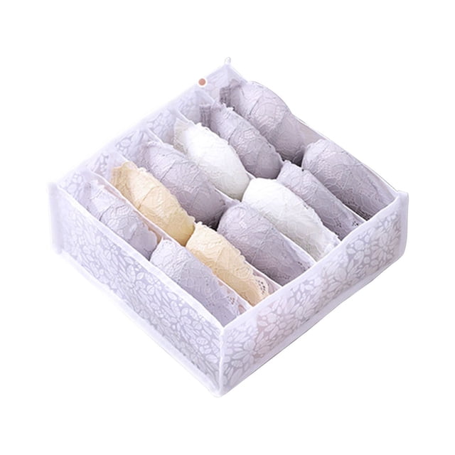 Organisateur de Vêtements pour Garde-Robe, un Organisateur à Compartiments en polyester Blanc avec Plusieurs sections pour Ranger Soigneusement des Articles de Vêtements comme des sous-Vêtements, des Chaussettes et des Foulards. le design Pliable et Lavable Présente un Motif floral sur les Côtés et une Poignée pour une Utilisation Facile. les Dimensions Sont 32x32x12 cm.