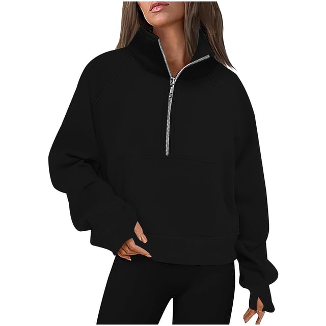 Timegard Half Zip Pullover for Women, a cropped long sleeve sweatshirt in solid black color. Features a half-zip design, thumb holes, and a front pocket. Made of soft, breathable fabric, ideal for fall and winter. Styled for casual wear with leggings or jeans.