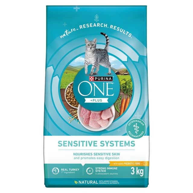 Purina ONE +Plus Sensitive Systems Turkey dry cat food 3 kg bag in blue and white packaging featuring a gray tabby cat above the brand logo, with images of kibble, carrots, and green fields, highlighting real turkey as the first ingredient, prebiotic fibre for digestion, and antioxidant sources supporting immune health.