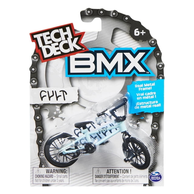 Tech Deck BMX finger bike Cult Bikes collectible mini BMX bicycle with real metal frame, light blue frame, black handlebars, seat, and wheels, packaged with choking hazard warning for ages 6 and up.