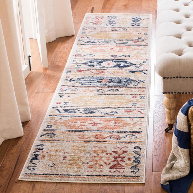 SAFAVIEH Charleston Rupert Distressed Southwestern Area Rug 2'x8' runner with traditional southwestern patterns in beige, navy, rust, and gold tones, power loomed synthetic yarns, placed on hardwood floor beside a beige tufted bench and cream curtains, ideal for hallways or entryways.