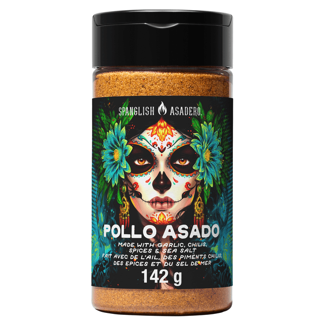Spanglish Pollo Asado Seasoning 142g in a clear plastic jar with a black lid, filled with orange-brown seasoning. The label features vibrant blue flowers and green leaves on a dark background, with white text describing a traditional blend of garlic, chilis, spices, and sea salt, suitable for grilling chicken or fish.