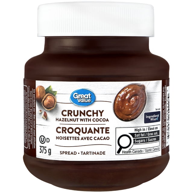 Great Value Crunchy Hazelnut with Cocoa Spread in a 375 g brown jar with a white lid, labeled in English and French with hazelnut and cocoa images and a Health Canada warning for high saturated fat and sugars, ideal for spreading on toast, pancakes, and baked goods.