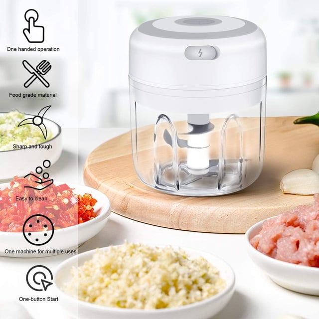 EGNMCR Vegetable Chopper Mini Garlic Chopper Wireless Portable Mini Electric Food Chopper, a compact kitchen gadget with a 250ml transparent container and white lid. Features three stainless steel blades for chopping garlic, chili, parsley, and more. USB rechargeable, lightweight, and ideal for camping, family meals, or outdoor use. Displayed on a wooden surface with bowls of chopped ingredients nearby.