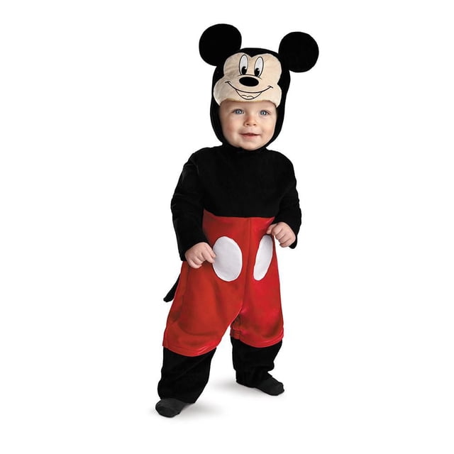 Infant Disney Baby Mickey Mouse Deluxe Costume with a plush black jumpsuit featuring red shorts with two white oval buttons, a detachable tail, and a soft Mickey headpiece with large ears and printed face, designed for easy diaper changes and comfort for infants and toddlers.