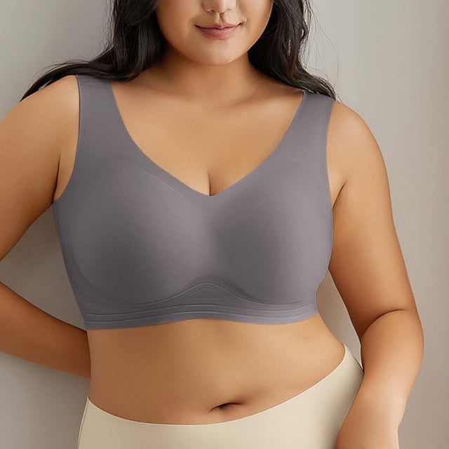 TIMIFIS Plus Size Bras for Women Seamless Push Up Full Coverages Daily Bra No Rims Comfortable Soft Seamless Wireless Bras. A grey wireless bra with a seamless design, wide straps, and full coverage, shown on a model. Made from lightweight polyester and nylon for comfort and breathability. Suitable for casual wear, yoga, or as sleepwear. Available in size XXXXXL with a bust range of 110-130 cm (43.31-51.18 inches).